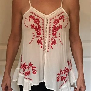 White blouse with red accents